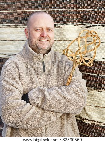 Man And Carpet Beater
