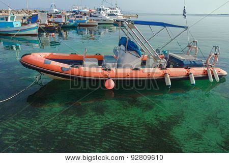 Rigid-hulled Inflatable Boat Floating On Calm Blue Transparent Sea Water Of Greek Kos Island
