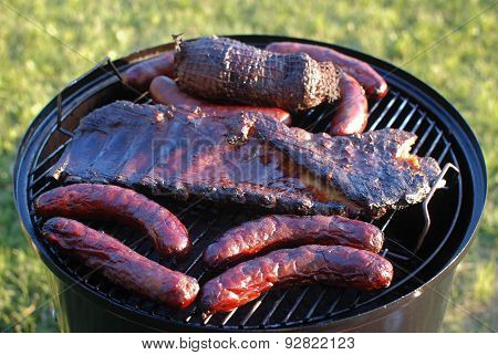 Assorted delicious grilled meats on a barbecue