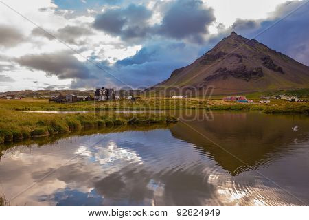 Sunset in the fishing village of Arnastapi. Evening in the Arctic