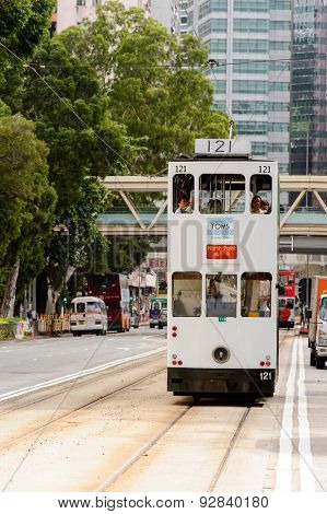 HONG KONG - JUNE 03, 2015: double-decker tram on street of HK. Hong Kong Tramways is a tram system in Hong Kong, being one of the earliest forms of public transport in the metropolis.