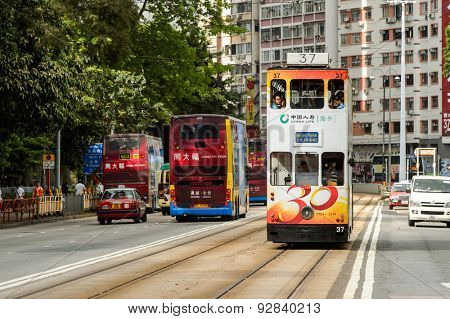 HONG KONG - JUNE 03, 2015: double-decker tram on street of HK. Hong Kong Tramways is a tram system in Hong Kong, being one of the earliest forms of public transport in the metropolis.
