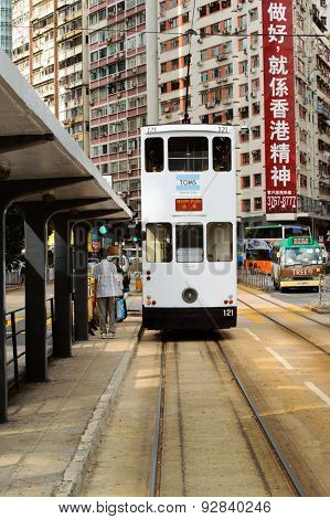 HONG KONG - JUNE 03, 2015: double-decker tram on street of HK. Hong Kong Tramways is a tram system in Hong Kong, being one of the earliest forms of public transport in the metropolis.