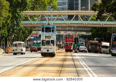 HONG KONG - JUNE 03, 2015: double-decker tram on street of HK. Hong Kong Tramways is a tram system in Hong Kong, being one of the earliest forms of public transport in the metropolis.