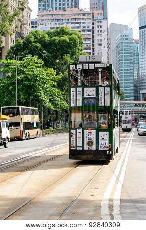 HONG KONG - JUNE 03, 2015: double-decker tram on street of HK. Hong Kong Tramways is a tram system in Hong Kong, being one of the earliest forms of public transport in the metropolis.