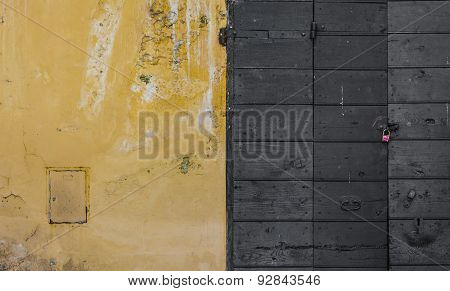 Scraped Wall And A Wooden Door