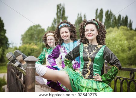Three Young Beautiful Girls In Irish Dance Dress Posing Outdoor