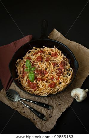 Linguine With Basil And Red Sauce In Cast Iron Pan