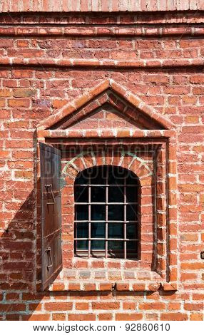 Old window in brick wall - Krutitskoe Compound Cathedral in Moscow Russia