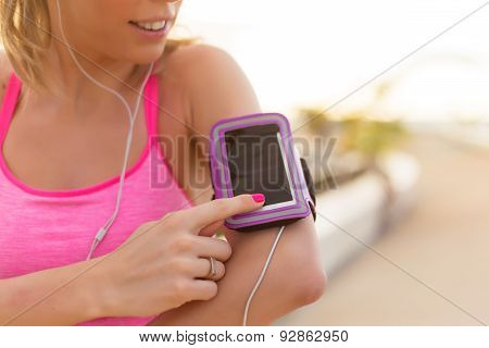 Woman using sports activity tracking app on her mobile phone