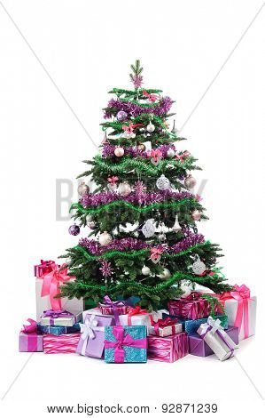 decorated Christmas tree with heap of gifts isolated on white background