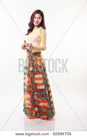 Beautiful Vietnamese Young Woman With Modern Style Ao Dai Holding A Paper Fan On White Background