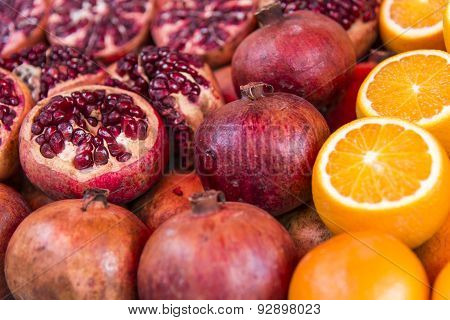 Pomegranate and oranges in market