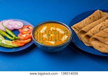 paneer butter masala with chapati / roti / paratha / fulka / indian bread and green salad