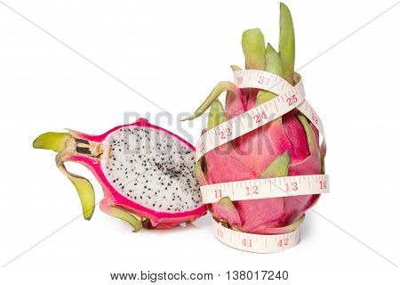 Dragon fruit with a tape measure isolated on white background