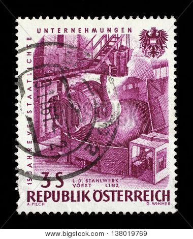 ZAGREB, CROATIA - SEPTEMBER 09: A stamp printed in Austria, devoted to 15th anniversary of nationalized industry, Pouring steel, VOEST, Linz, circa 1961, on September 09, 2014, Zagreb, Croatia