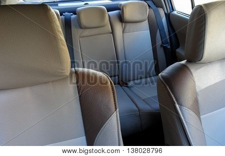 Car interior with bright leather upholstery on the car seats stock image