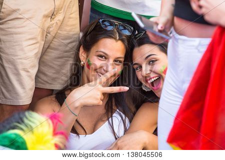 PORTO, PORTUGAL - JUL 10, 2016: Portuguese fans during video translation of the football match Portugal - France final of the European championship 2016, in Liberdade Square at city center of Porto. 
