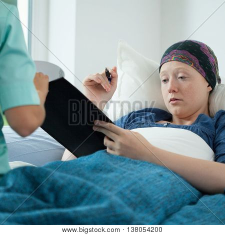 Cancer Woman Signing Documents