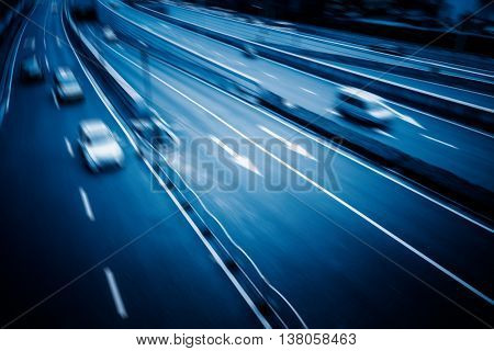 blurred car speeding on highway