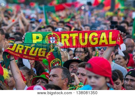 PORTO, PORTUGAL - JUL 10, 2016: Portuguese fans during translation of the football match Portugal - France final of the European championship 2016, in Liberdade Square at city center of Porto. 