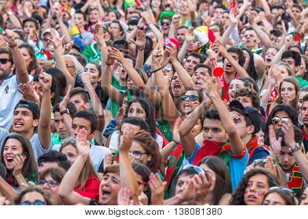 PORTO, PORTUGAL - JUL 10, 2016: Portuguese fans during translation of the football match Portugal - France final of the European championship 2016, in Liberdade Square at city center of Porto. 