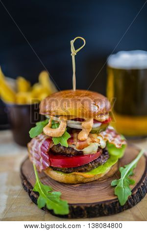 Tasty street food grilled double beef burger in crispy shortbread with lettuce and mayonnaise
