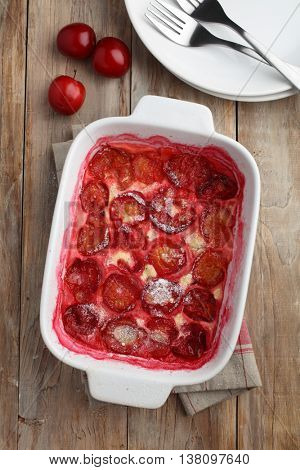 Plum clafoutis in a baking dish