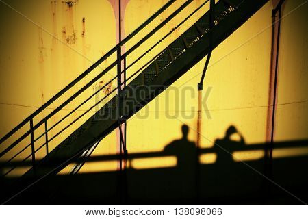People Shadows On Old Metal Tanks In Power Plant,