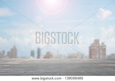 Old wooden floor in day with sunlight and city view background nobody empty