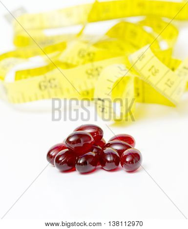 picture of a red krill oil capsules isolated on white background