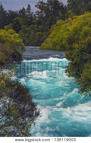 The Huka Falls are a set of waterfalls on the Waikato River that drains Lake Taupo in New Zealand.