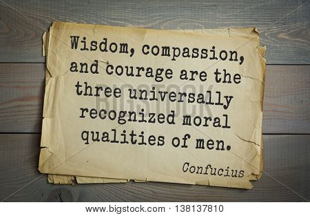 Ancient chinese philosopher Confucius quote on old paper background.  Wisdom, compassion, and courage are the three universally recognized moral qualities of men.