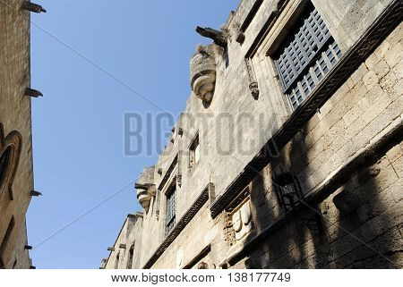 old houses with decorative elements on a narrow street