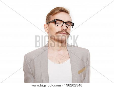 Young stylish blond man in beige blazer isolated at white. Portrait of confident guy looking at camera. Boy style, trendy male person in eyeglasses and black suit. Modern businessman.