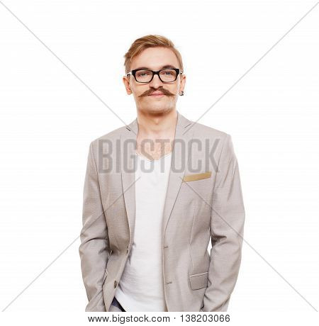 Young stylish blond man in beige blazer isolated at white. Portrait of confident guy looking at camera. Boy style, trendy male person in eyeglasses and black suit. Modern businessman.