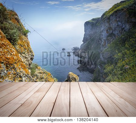 Empty wooden platform and Cape Kaliakra, Bulgaria. Rocky coast of Cape with sea views.