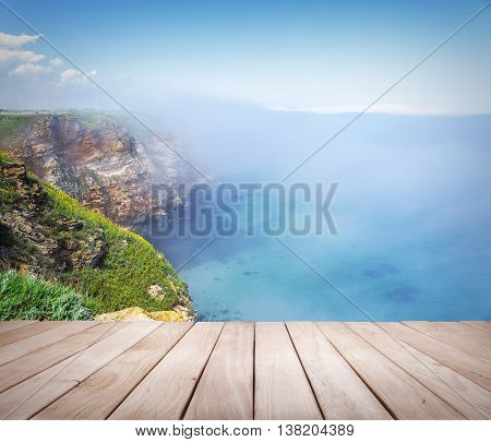 Empty wooden platform and Cape Kaliakra, Bulgaria. Rocky coast of Cape with sea views.