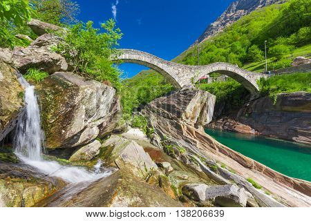 Double arch stone bridge at Ponte dei Salti with waterfall Lavertezzo Verzascatal Canton Tessin.