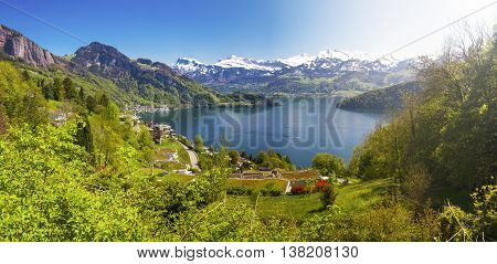 Panorama view to village Vitznau lake Lucerne (Vierwaldstattersee) and Swiss Alps near Luzern city.