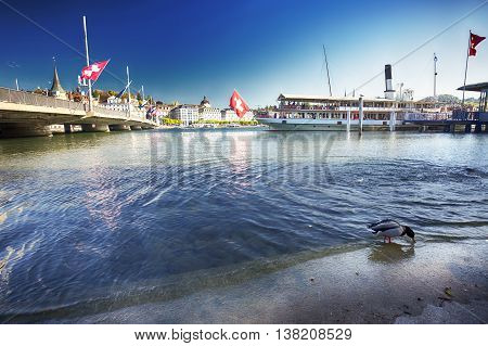 LUCERNE SWITZERLAND - May 5 2016 - Steam boat on lake Lucerne (Vierwaldstatersee) in harbor with the old city in the background Switzerland