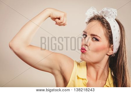 Happy Pretty Pin Up Girl Showing Off Muscles.