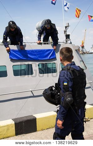 Odesa, Ukraine - July 03, 2016: Military sailors near new warship 'Akerman'. Celebration of Ukrainian NAVY forces day