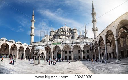 ISTANBUL TURKEY - MAY 28 2016: Tourists visit Blue Mosque in Istanbul. It was built from 1609 to 1616 during the rule of Sultan Ahmed