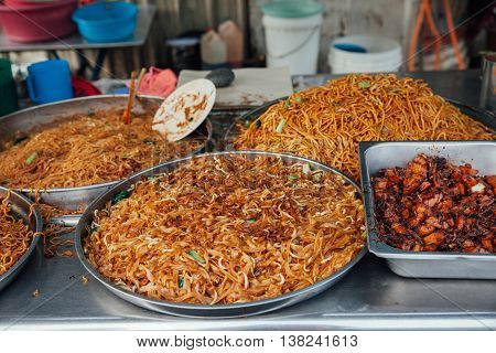 Kway teow fried noodles at the Kimberly Street Food Night Market George Town Penang Malaysia.