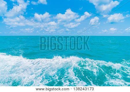 Trail on sea water surface behind  boat