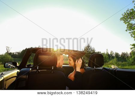 bride and groom. Young wedding couple enjoying romantic moments outside on a summer meadow. Happy bride and groom on their wedding. Stylish beautiful happy bride and groom wedding celebrations