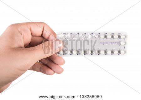 tablets Birth Control Pills in the hand, isolated on white background