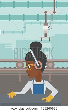 An african-american woman working on metal press machine. Worker in headphones operating metal press machine at workshop. Woman using press machine. Vector flat design illustration. Vertical layout.