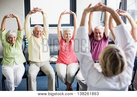 Seniors doing exercises in a retirement home